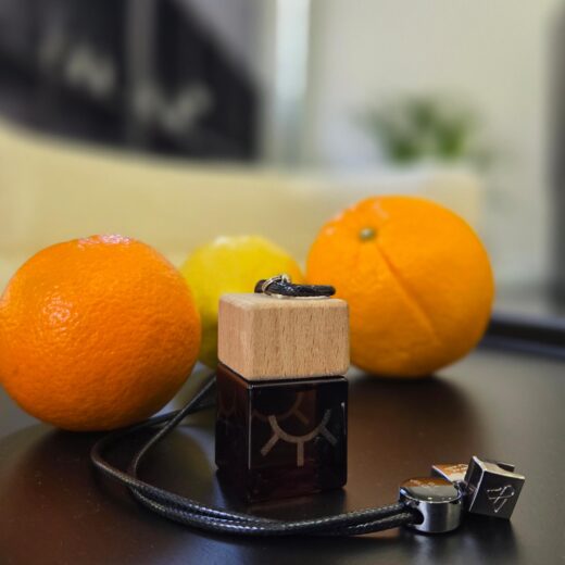 Valencia car perfume with fresh citrus and jasmine scent in a sleek bottle